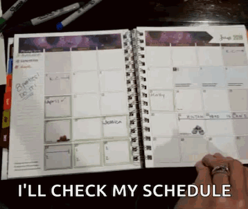A Person With A Ring On Their Finger Is Checking Their Schedule GIF
