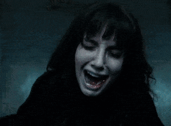 A Person With A Ring On Their Finger Is Holding A Black Object GIF