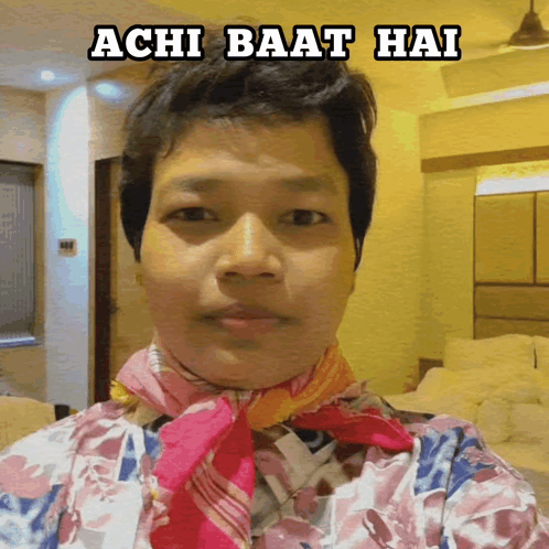A Person With A Scarf Around Their Neck And The Words Achi Baat Hai Above Them GIF