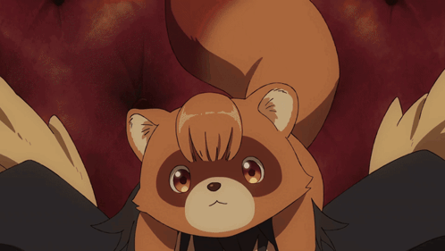 A Person With A Stuffed Animal On Their Head That Looks Like A Raccoon GIF