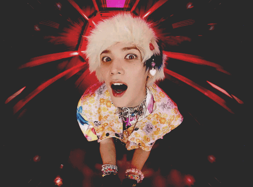 A Person With A Surprised Look On Their Face Is Wearing A Furry Hat GIF