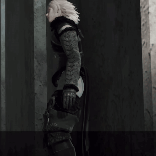 A Person With A Tattoo On Their Arm Is Standing Next To A Wall GIF