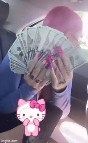 A Person With Pink Hair Is Holding A Bunch Of Money In Front Of A Hello Kitty . GIF