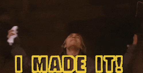 A Person With Their Arms Outstretched And The Words I Made It Behind Them GIF