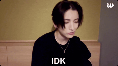 A Person With Their Eyes Closed And The Word Idk On The Bottom GIF