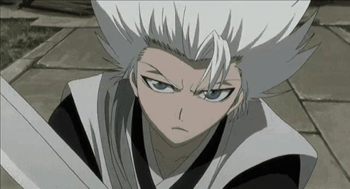 A Person With White Hair And Blue Eyes Is Holding A Sword GIF