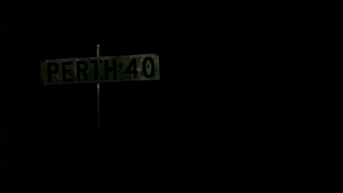 A Perth 40 Street Sign In The Dark GIF