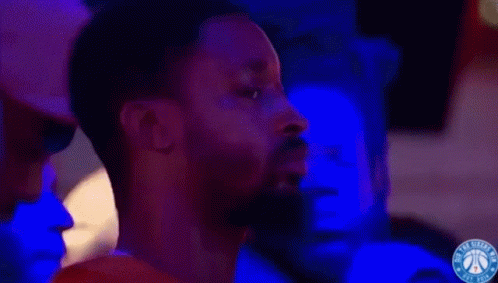 A Philadelphia Basketball Game Is Being Played In Front Of A Scoreboard GIF
