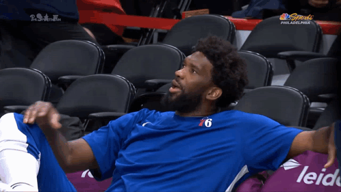 A Philadelphia Basketball Player Sits In The Stands GIF