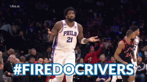 A Philadelphia Basketball Player Stands In Front Of A Crowd During A Game GIF