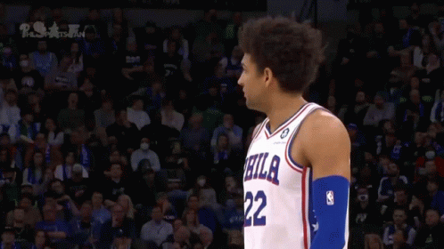 A Philadelphia Basketball Player Stands In Front Of The Crowd GIF