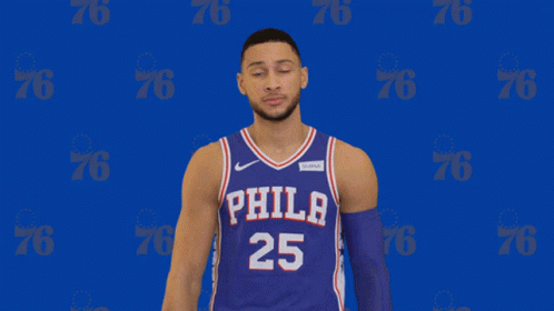 A Philadelphia Basketball Player Wearing Number 25 Poses For A Photo GIF