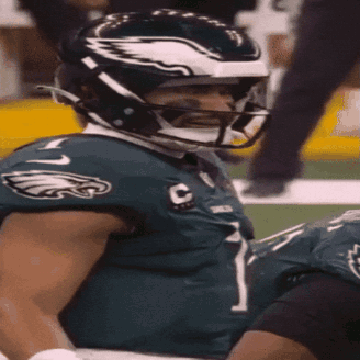 A Philadelphia Eagles Football Player Wearing A Helmet GIF
