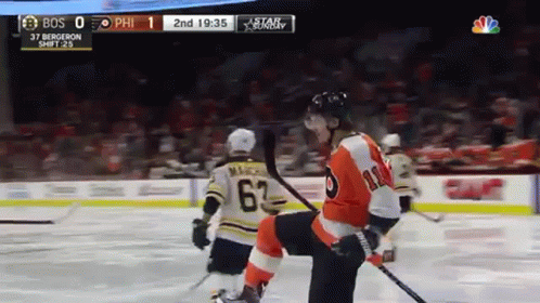 A Philadelphia Flyers Hockey Player Kneeling On The Ice During A Game GIF