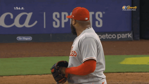 A Philadelphia Phillies Baseball Player Stands On The Field During A Game GIF