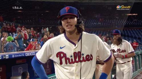 A Philadelphia Phillies Baseball Player Wearing Headphones And A Microphone GIF