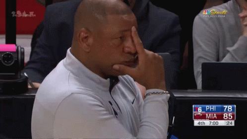 A Philadelphia Sports Broadcast Shows A Man Covering His Face GIF
