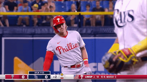 A Phillies Baseball Player Stands In Front Of The Catcher GIF