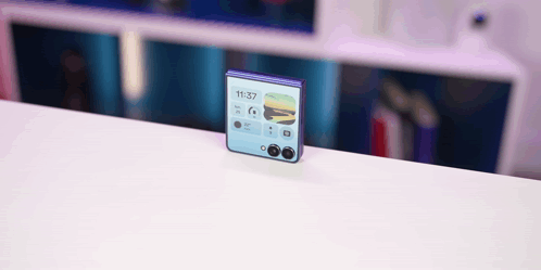 A Phone Displays The Time As 11:37 On The Screen GIF