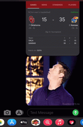 A Phone Screen Shows A Basketball Game Between Oklahoma And Kansas With The Score 15-35 GIF