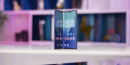 A Phone With A Purple Background Shows The Time As 8:20 GIF