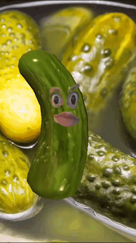 A Pickle With A Face On It Is Surrounded By Pickles GIF