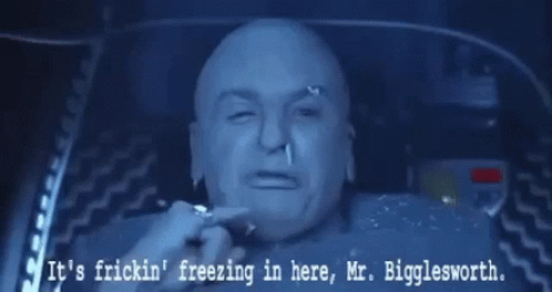 A Picture Of A Bald Man With The Words " It 'S Fricking Freezing In Here Mr. Bigglesworth " GIF