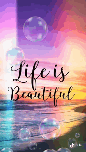 A Picture Of A Beach With Bubbles And The Words `` Life Is Beautiful '' . GIF