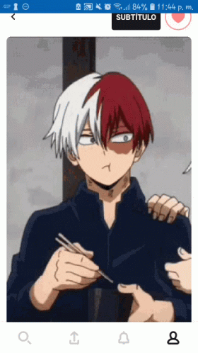A Picture Of A Boy With Red And White Hair Is Displayed On A Cell Phone Screen GIF
