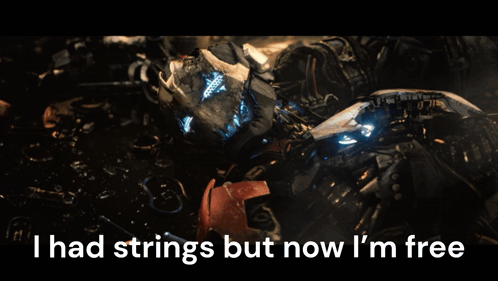 A Picture Of A Broken Robot With The Words I Had Strings But Now I 'M Free GIF