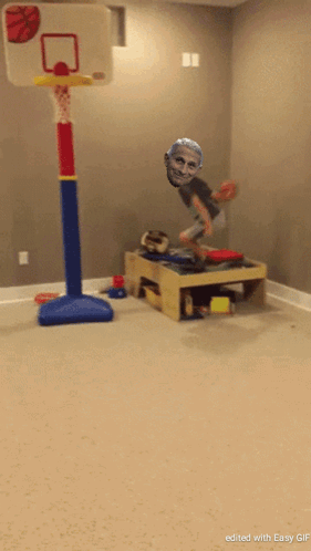 A Picture Of A Child Jumping In The Air With A Basketball Hoop In The Background GIF