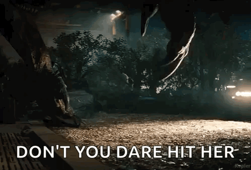 A Picture Of A Dinosaur With The Words " Do N't You Dare Hit Her " On It GIF