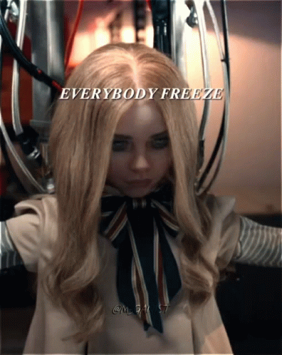 A Picture Of A Doll With The Words " Everybody Freeze " On It GIF