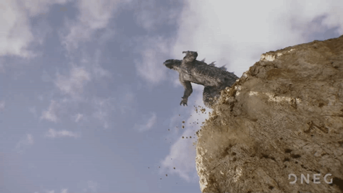 A Picture Of A Dragon Flying Over A Cliff With The Word Oneg In The Corner GIF