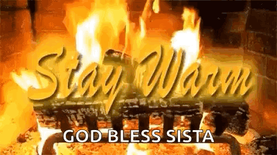 A Picture Of A Fireplace With The Words `` Stay Warm '' And `` God Bless Sista '' Written On It . GIF