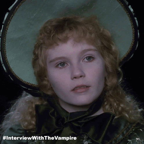 A Picture Of A Girl With #Interviewwiththevampire Written Below It GIF