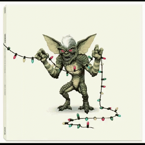 A Picture Of A Gremlin Holding A String Of Lights GIF