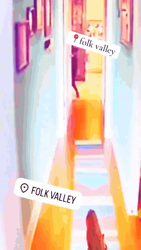 A Picture Of A Hallway With A Sticker That Says Folk Valley On It GIF