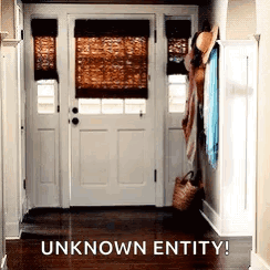 A Picture Of A Hallway With A White Door And The Words `` Unknown Entity '' Above It . GIF