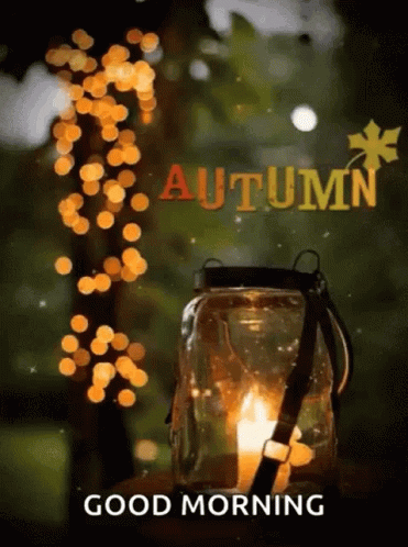 A Picture Of A Lantern With A Candle In It And The Words `` Good Morning Autumn '' . GIF