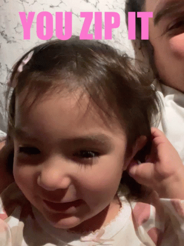 A Picture Of A Little Girl With The Words You Zip It GIF