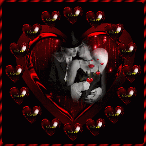 A Picture Of A Man And Woman Kissing In A Heart Surrounded By Hearts With The Word Love On Them GIF