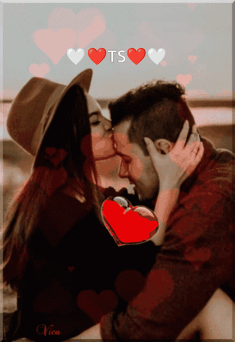 A Picture Of A Man And Woman Kissing With Hearts And The Word Ts Above Them GIF
