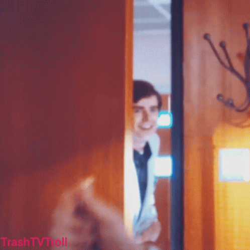 A Picture Of A Man Behind A Door That Says Trashtv Troll On It GIF