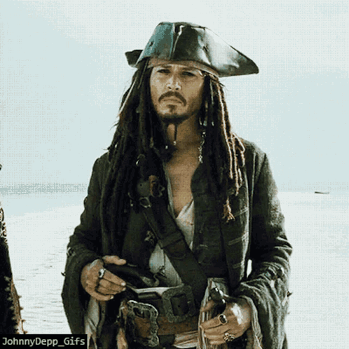 A Picture Of A Man Dressed As A Pirate With Dreadlocks GIF