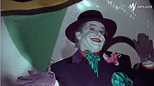 A Picture Of A Man Dressed As The Joker With Jwplayer In The Corner GIF