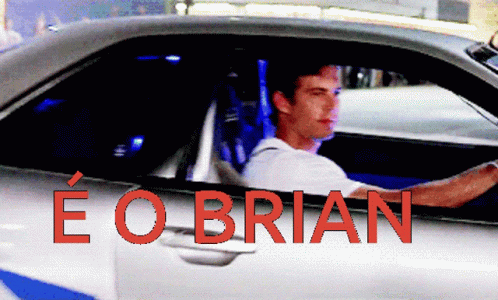 A Picture Of A Man Driving A Car With The Name Eo Brian On It GIF