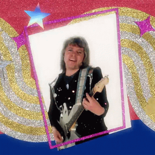 A Picture Of A Man Holding A Guitar In Front Of A Glittery Background GIF
