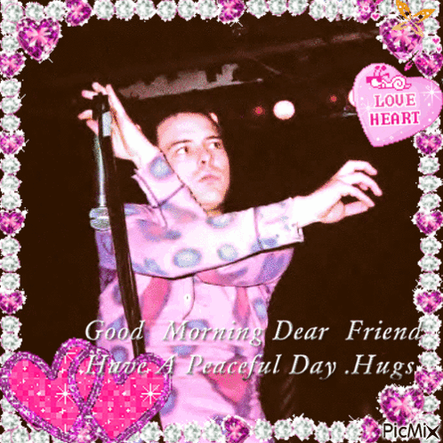 A Picture Of A Man Holding A Microphone With The Words Good Morning Dear Friend Have A Peaceful Day Hugs On The Bottom GIF