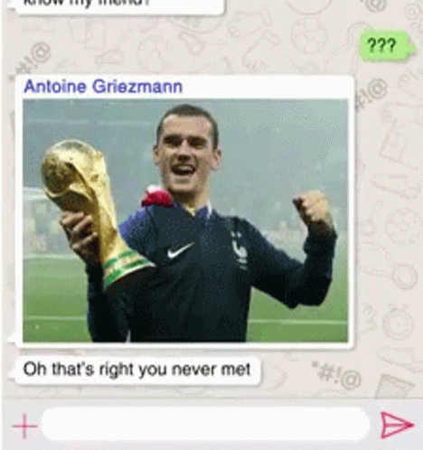 A Picture Of A Man Holding A Trophy With The Name Antoine Griezmann At The Top GIF